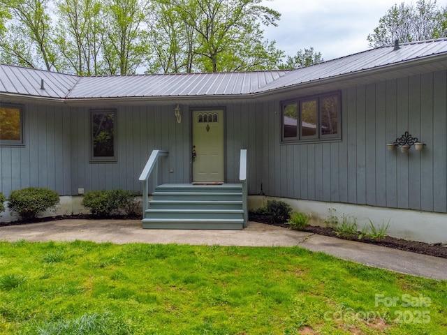 362 Cowan Valley Ests, Sylva, NC 28779 - view of exterior entry with a lawn and metal roof