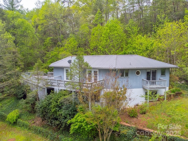 362 Cowan Valley Ests, Sylva, NC 28779 - back of house featuring a view of trees, metal roof, and a wooden deck