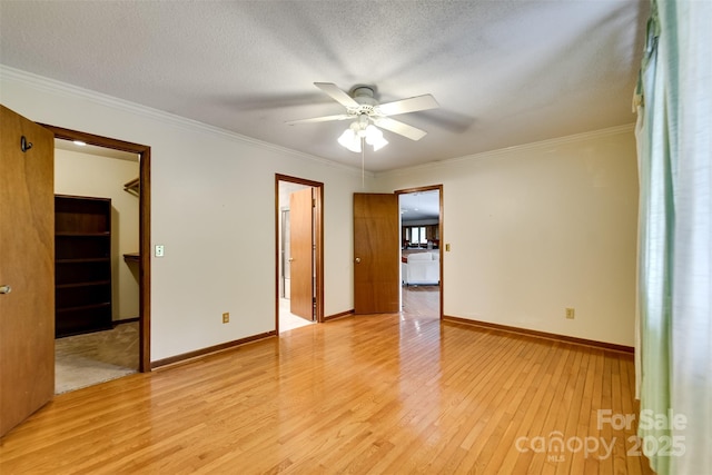 362 Cowan Valley Ests, Sylva, NC 28779 - unfurnished room featuring light wood-style flooring, ceiling fan, crown molding, a textured ceiling, and baseboards