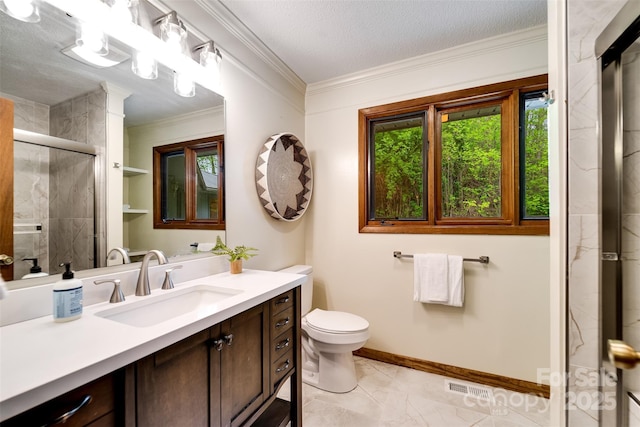 362 Cowan Valley Ests, Sylva, NC 28779 - bathroom featuring a shower stall, ornamental molding, toilet, marble look tile flooring, and vanity