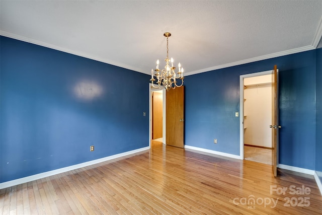 362 Cowan Valley Ests, Sylva, NC 28779 - unfurnished room featuring a chandelier, wood-type flooring, baseboards, and ornamental molding
