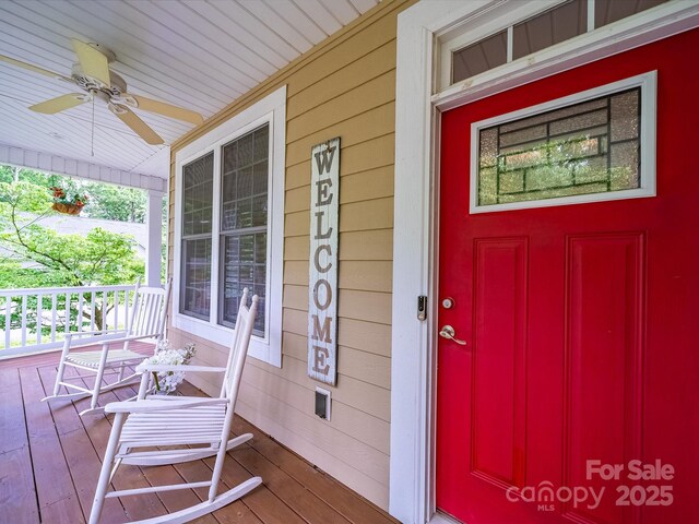 property entrance with a porch and ceiling fan