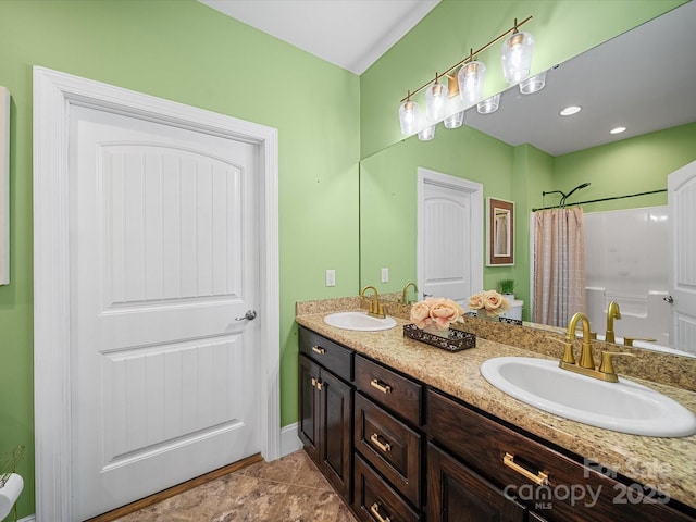bathroom with double vanity and a shower with curtain