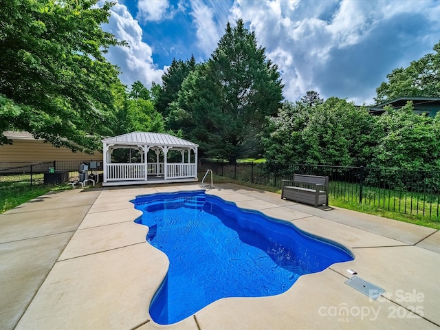 view of pool with a gazebo, a patio area, and fence