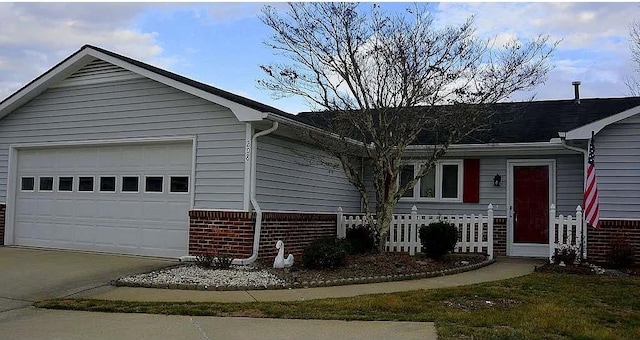 ranch-style home with an attached garage, driveway, and brick siding