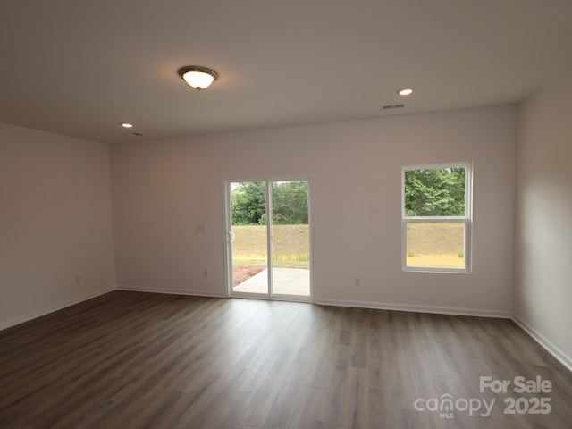 1119 Overbrook Pl, Wingate, NC 28174 - empty room featuring dark wood-style floors, baseboards, and recessed lighting