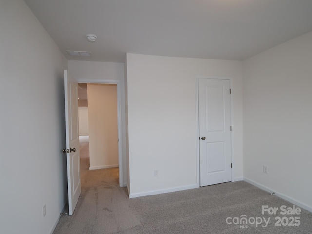 1119 Overbrook Pl, Wingate, NC 28174 - unfurnished bedroom featuring carpet floors and baseboards