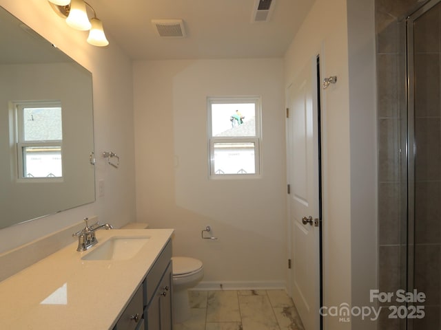 1119 Overbrook Pl, Wingate, NC 28174 - full bathroom with vanity, plenty of natural light, toilet, and marble finish flooring