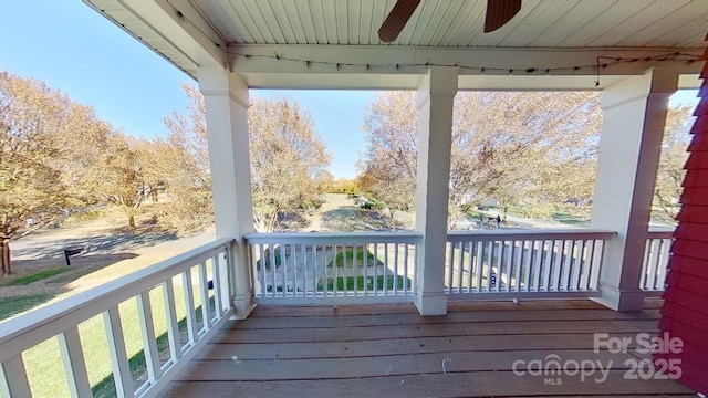 wooden terrace featuring ceiling fan