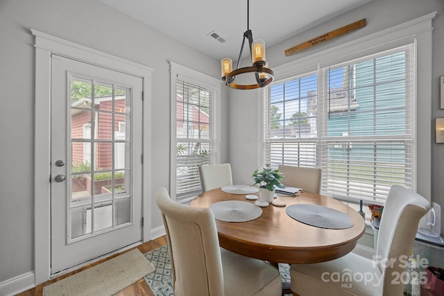 1508 Peaceful Way Dr, Charlotte, NC 28206 - dining space featuring a chandelier, plenty of natural light, and baseboards