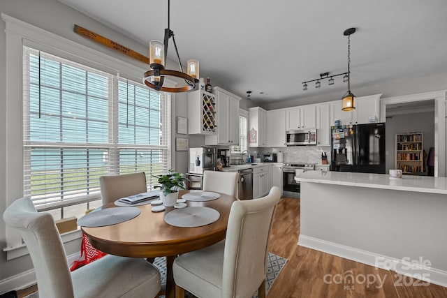 1508 Peaceful Way Dr, Charlotte, NC 28206 - dining area featuring a chandelier and wood finished floors