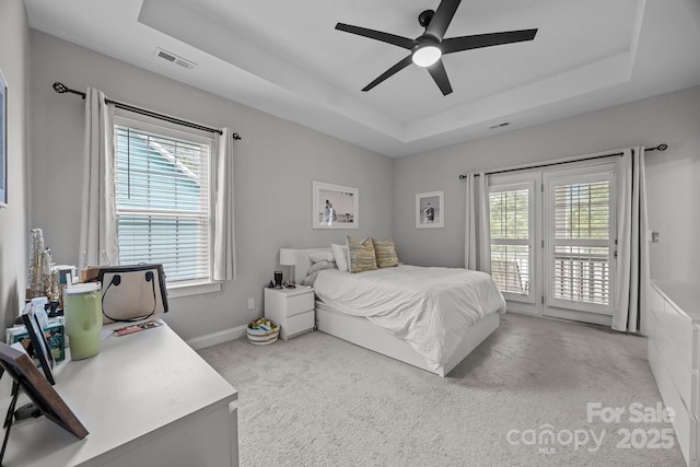 1508 Peaceful Way Dr, Charlotte, NC 28206 - bedroom featuring access to exterior, a raised ceiling, light carpet, and ceiling fan