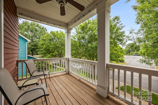1508 Peaceful Way Dr, Charlotte, NC 28206 - deck with a ceiling fan and view of wooded area