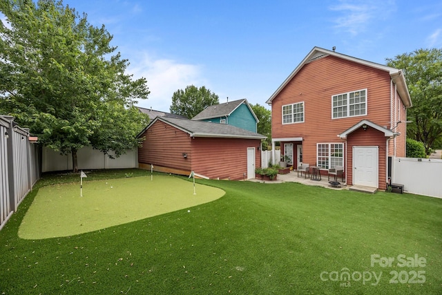 1508 Peaceful Way Dr, Charlotte, NC 28206 - rear view of property featuring an area to practice putting and a patio area