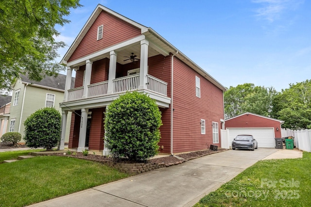 1508 Peaceful Way Dr, Charlotte, NC 28206 - greek revival house with a balcony, a detached garage, an outdoor structure, and ceiling fan