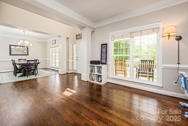 141 Culpeze Rd, Mooresville, NC 28117 - dining area featuring ornate columns, wood finished floors, plenty of natural light, crown molding, and a chandelier