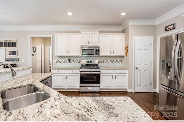 141 Culpeze Rd, Mooresville, NC 28117 - kitchen with appliances with stainless steel finishes, a sink, crown molding, dark wood-style flooring, and white cabinets