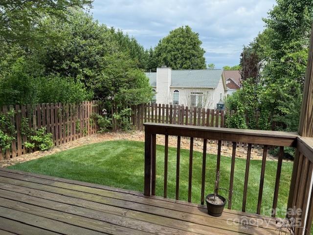 134 Walmsley Pl, Mooresville, NC 28117 - wooden terrace featuring a fenced backyard and a lawn