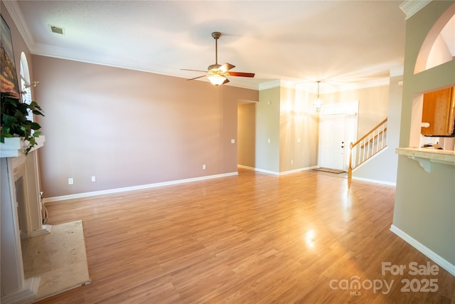 134 Walmsley Pl, Mooresville, NC 28117 - unfurnished living room featuring ornamental molding, light wood finished floors, baseboards, visible vents, and a ceiling fan