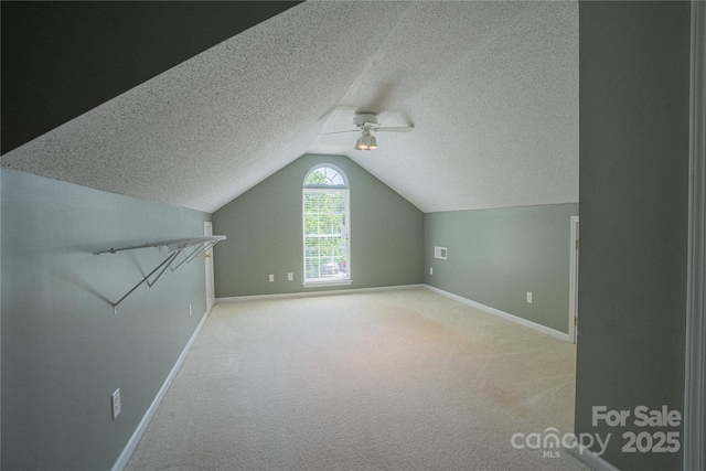 134 Walmsley Pl, Mooresville, NC 28117 - additional living space with lofted ceiling, carpet, and baseboards