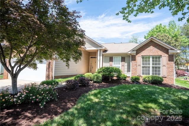 134 Walmsley Pl, Mooresville, NC 28117 - ranch-style home featuring a front lawn, an attached garage, concrete driveway, and brick siding