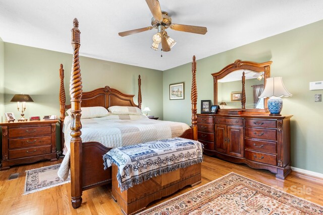 bedroom with a ceiling fan and wood finished floors