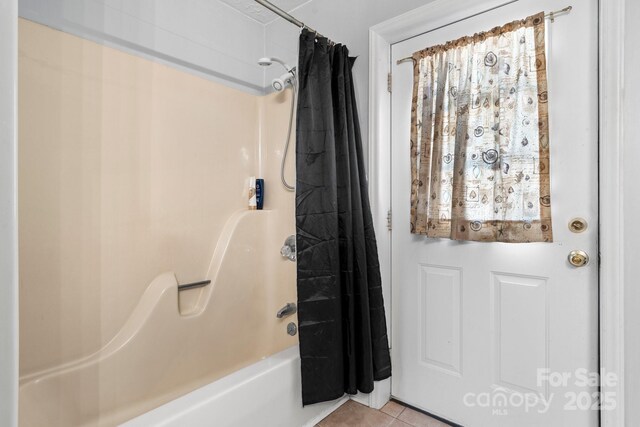 full bathroom with tile patterned flooring and shower / bathtub combination with curtain
