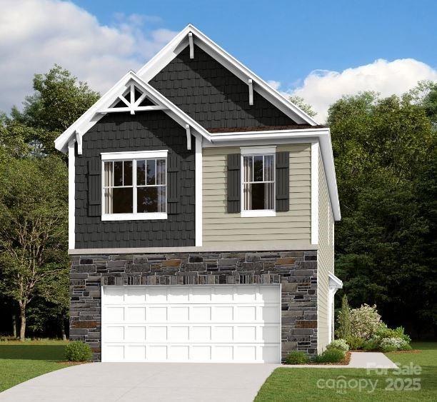 view of front facade with a garage, concrete driveway, and stone siding