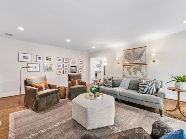 living room featuring wood finished floors, crown molding, and recessed lighting