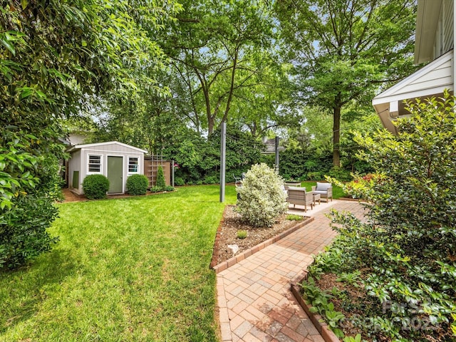view of yard featuring an outdoor structure and a patio area