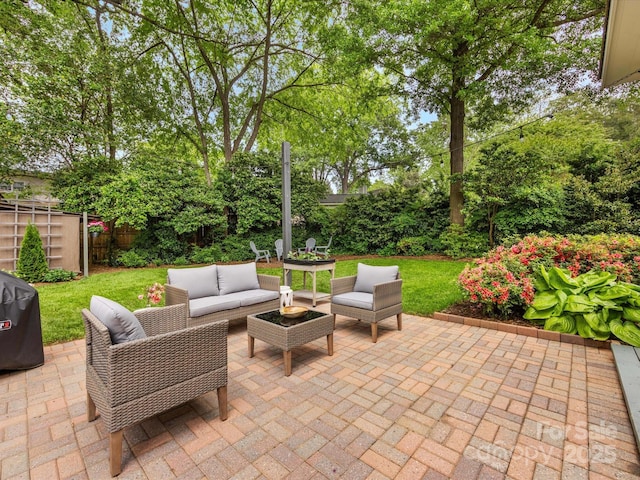 view of patio / terrace with an outdoor hangout area and fence