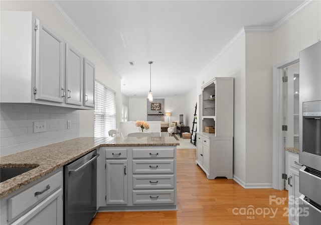 kitchen featuring a peninsula, light wood-style floors, backsplash, gray cabinets, and appliances with stainless steel finishes