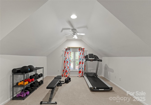 exercise area with a ceiling fan, baseboards, carpet, and vaulted ceiling