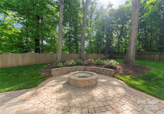 view of patio / terrace featuring a fenced backyard and a fire pit