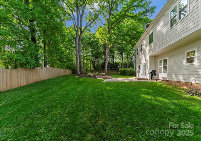 view of yard featuring a patio area and fence