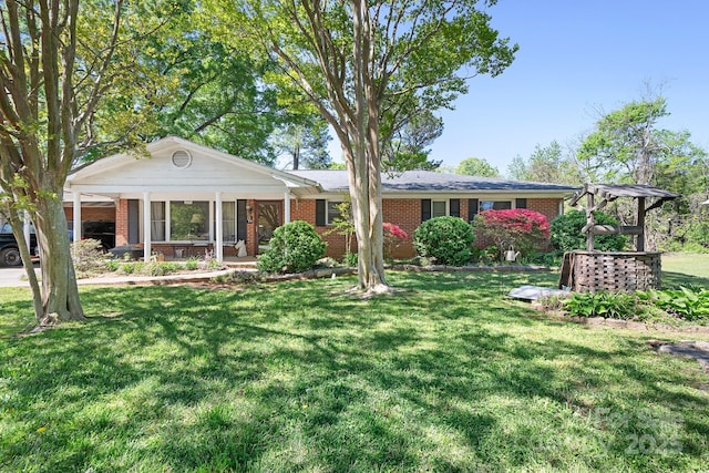 3265 W Innes St, Salisbury, NC 28144 - single story home with a front lawn, brick siding, and a porch