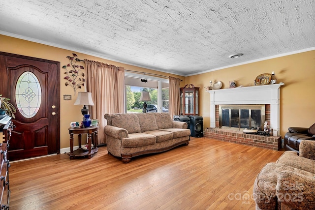 3265 W Innes St, Salisbury, NC 28144 - living room with ornamental molding, a brick fireplace, and light wood-type flooring