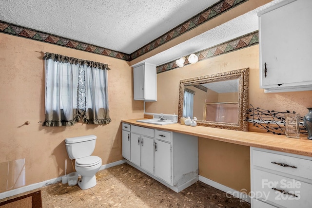 3265 W Innes St, Salisbury, NC 28144 - full bathroom featuring toilet, a textured ceiling, baseboards, a shower stall, and vanity