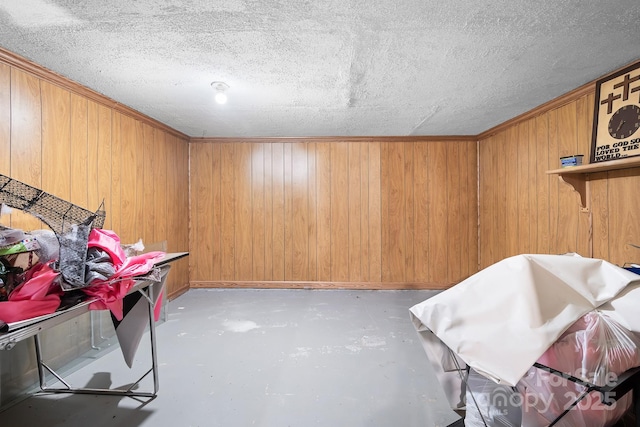 3265 W Innes St, Salisbury, NC 28144 - miscellaneous room with ornamental molding, wood walls, and concrete floors