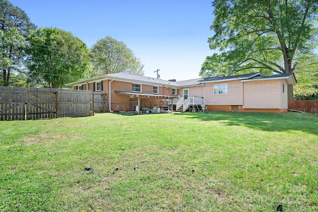3265 W Innes St, Salisbury, NC 28144 - back of house featuring a fenced backyard, brick siding, and a yard