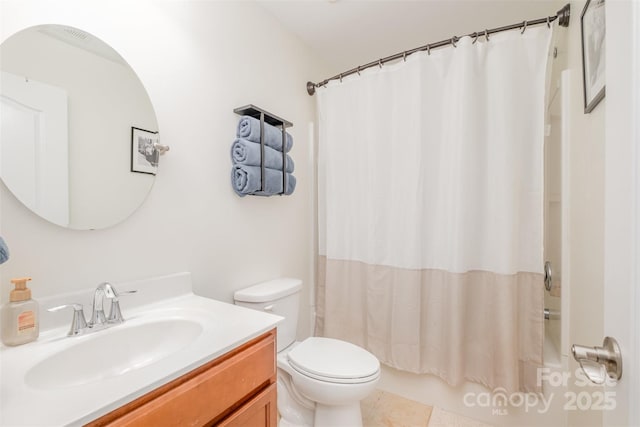 bathroom with tile patterned floors, shower / bath combo, vanity, and toilet