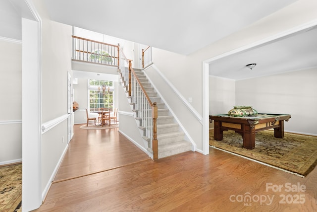 14812 Stonegreen Ln, Huntersville, NC 28078 - foyer entrance with baseboards, wood finished floors, stairs, and pool table