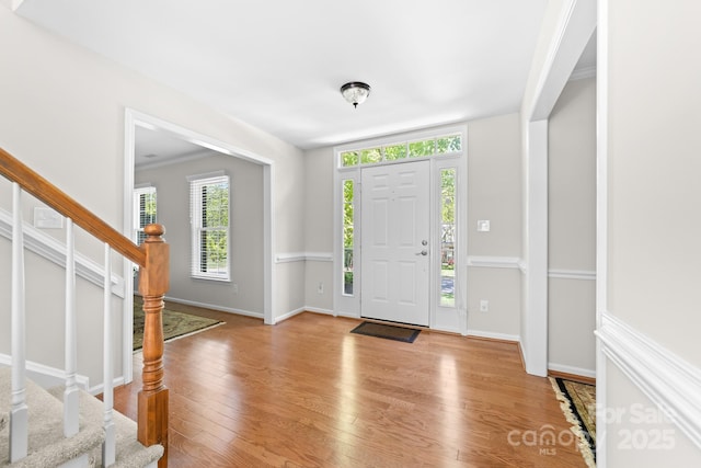14812 Stonegreen Ln, Huntersville, NC 28078 - foyer with a wealth of natural light, light wood-style floors, and stairway