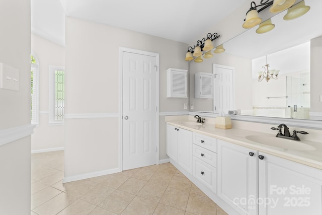 14812 Stonegreen Ln, Huntersville, NC 28078 - bathroom featuring double vanity, tile patterned flooring, a notable chandelier, and a sink