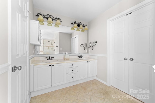 14812 Stonegreen Ln, Huntersville, NC 28078 - bathroom featuring double vanity, tile patterned flooring, tiled shower, and a sink