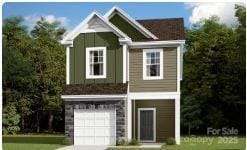 view of front of property featuring concrete driveway and an attached garage