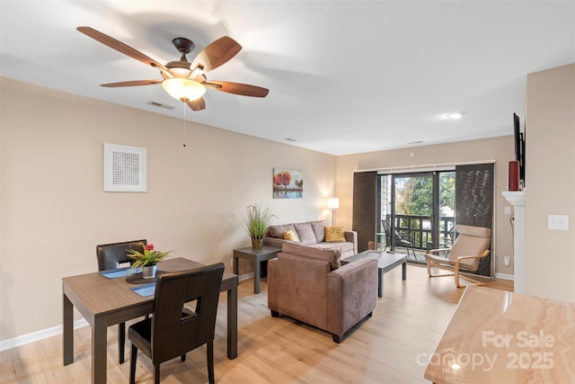 9029 J M Keynes Dr Unit 63, Charlotte, NC 28262 - living area with baseboards, visible vents, light wood-style floors, and ceiling fan