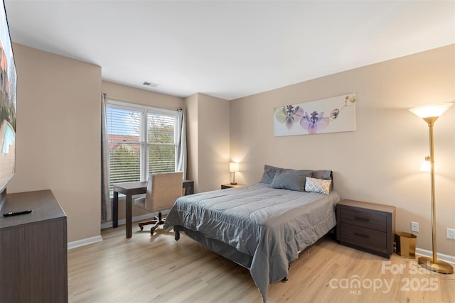 9029 J M Keynes Dr Unit 63, Charlotte, NC 28262 - bedroom featuring visible vents, light wood finished floors, and baseboards
