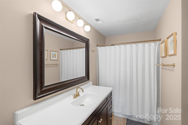 9029 J M Keynes Dr Unit 63, Charlotte, NC 28262 - full bath featuring visible vents, tile patterned floors, vanity, and a shower with curtain