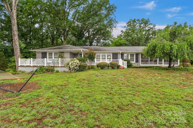 1607 Old Lawyers Rd, Marshville, NC 28103 - ranch-style house with a sunroom, a front yard, and a wooden deck